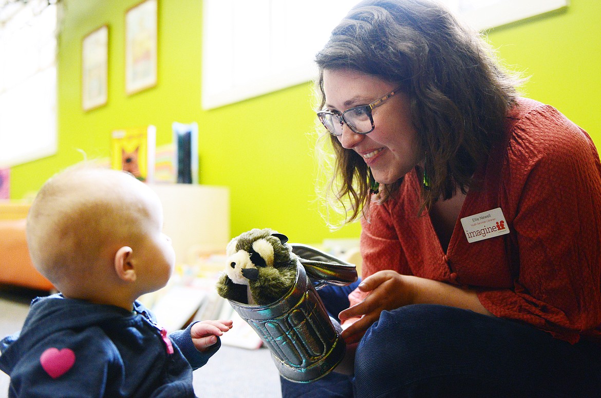 Ellie Newell, Youth Services Librarian at ImagineIF Library Kalispell, entertains a young visitor with a puppet on Friday, March 6, 2020. (Casey Kreider/Daily Inter Lake FILE)