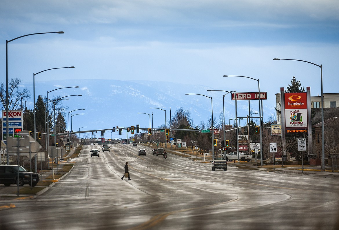 Traffic trickles in and out of downtown Kalispell along U.S. 93 on March 29, one day after a mandatory stay-at-home order issued by Gov. Steve Bullock took effect temporarily closing non-essential businesses. (Casey Kreider/Daily Inter Lake)