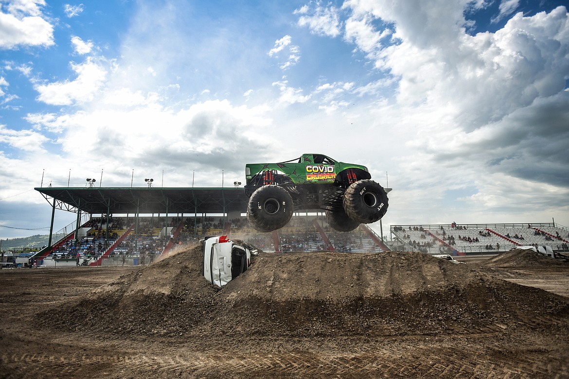 COVID Crusher clears a jump during a No Limits Monster Trucks show at the Flathead County Fairgrounds on Saturday, June 13. (Casey Kreider/Daily Inter Lake)