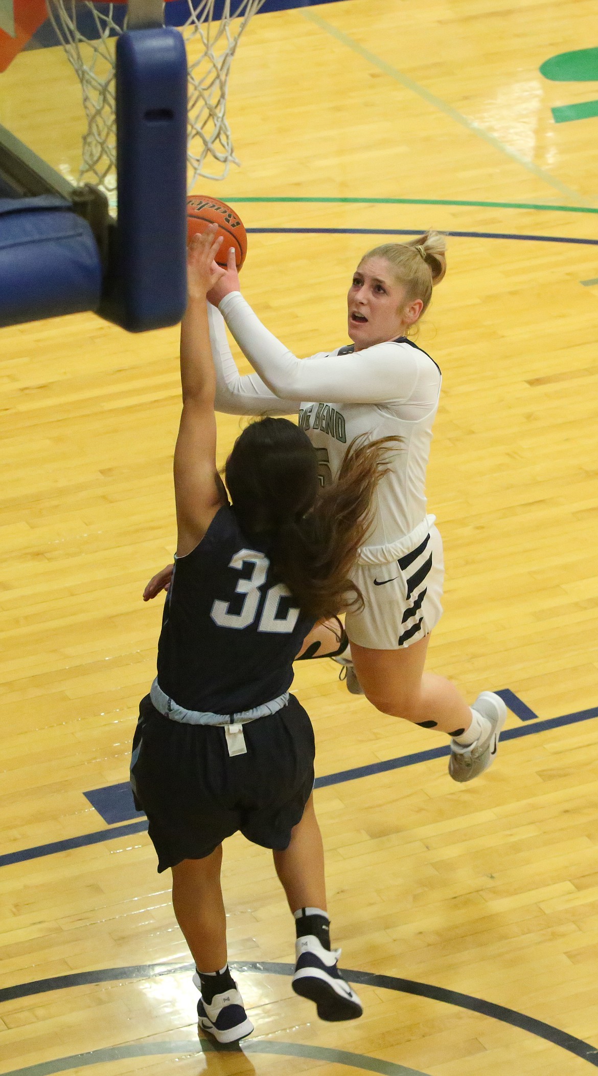 Connor Vanderweyst/Columbia Basin Herald 
 Big Bend guard Kayla Luke shoots over a Columbia Basin defender.