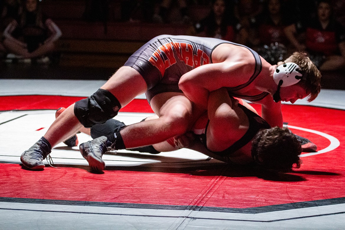 Casey McCarthy/Columbia Basin Herald Ephrata senior Mac Laird controls his opponent, Eric Gomez, picking up the pin in the second round of their bout on Thursday night at Othello High School.