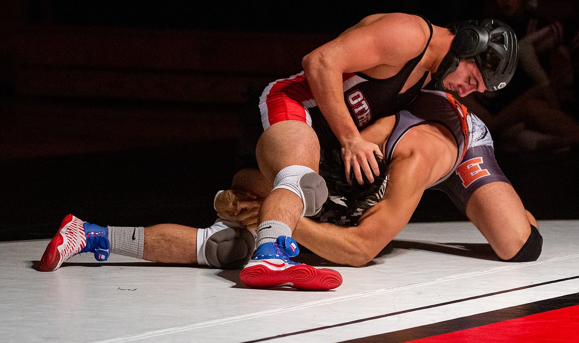 Casey McCarthy/Columbia Basin Herald Nathan Garza picked up the pin against Ephrata's Brian Olivera in the 170 weight class on Thursday night.