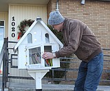 A little library stands tall in a Moses Lake neighborhood