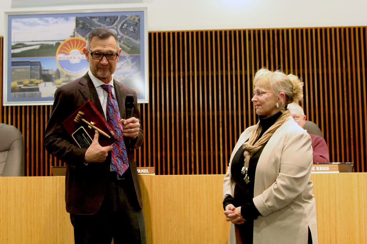 Newly-elected Mayor David Curnel gives a speech in honor of outgoing Mayor Karen Liebrecht before handing her a plaque.