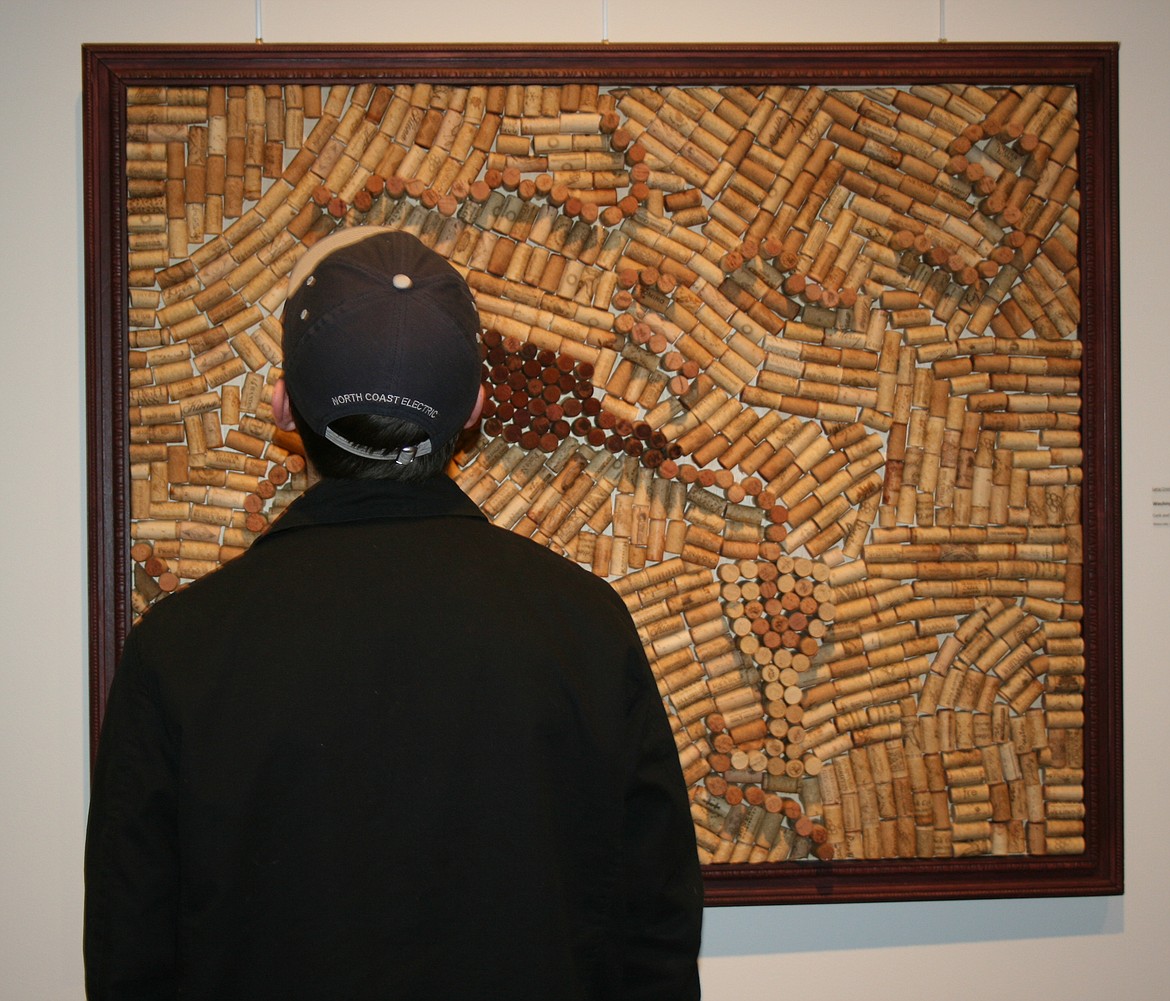 Art lovers filled the Moses Lake Museum & Art Center Friday night for the opening of the wine-themed show “Uncorked.”