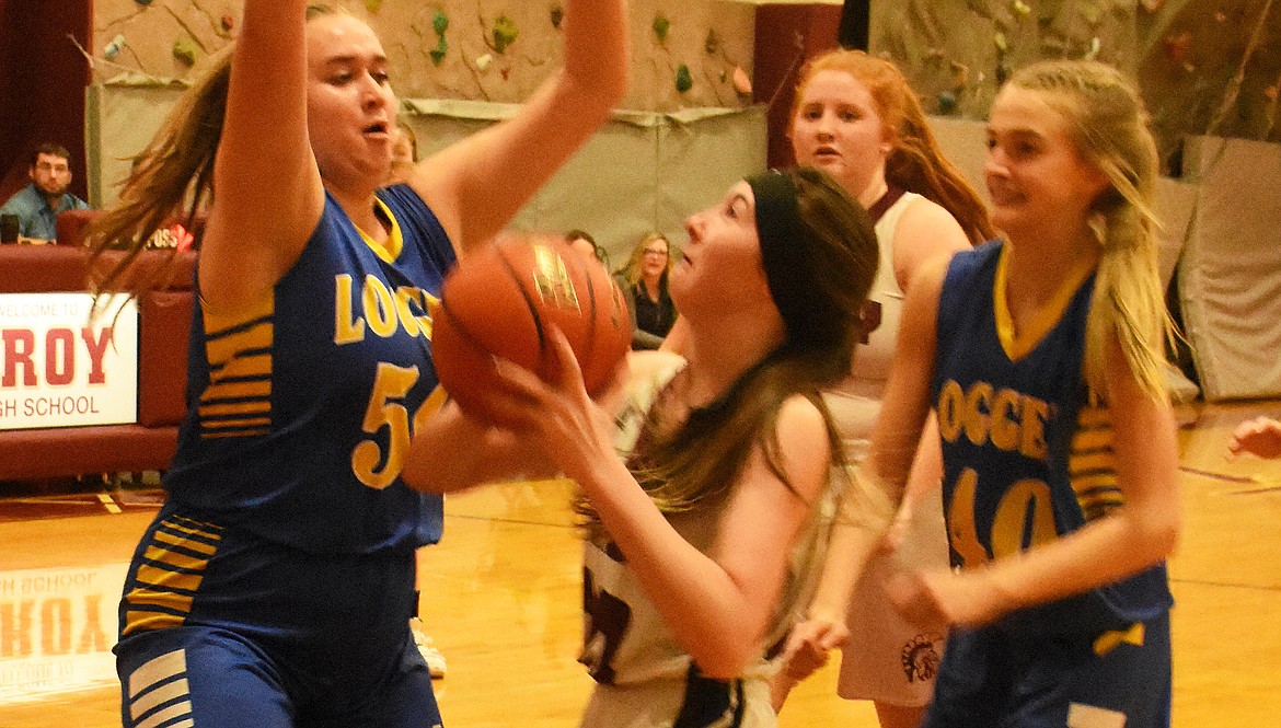 Troy’s Jayden Leighty tries to break free of the Libby Lady Loggers’ defense during a 48-14 loss Jan. 21. (Duncan Adams/The Western News)