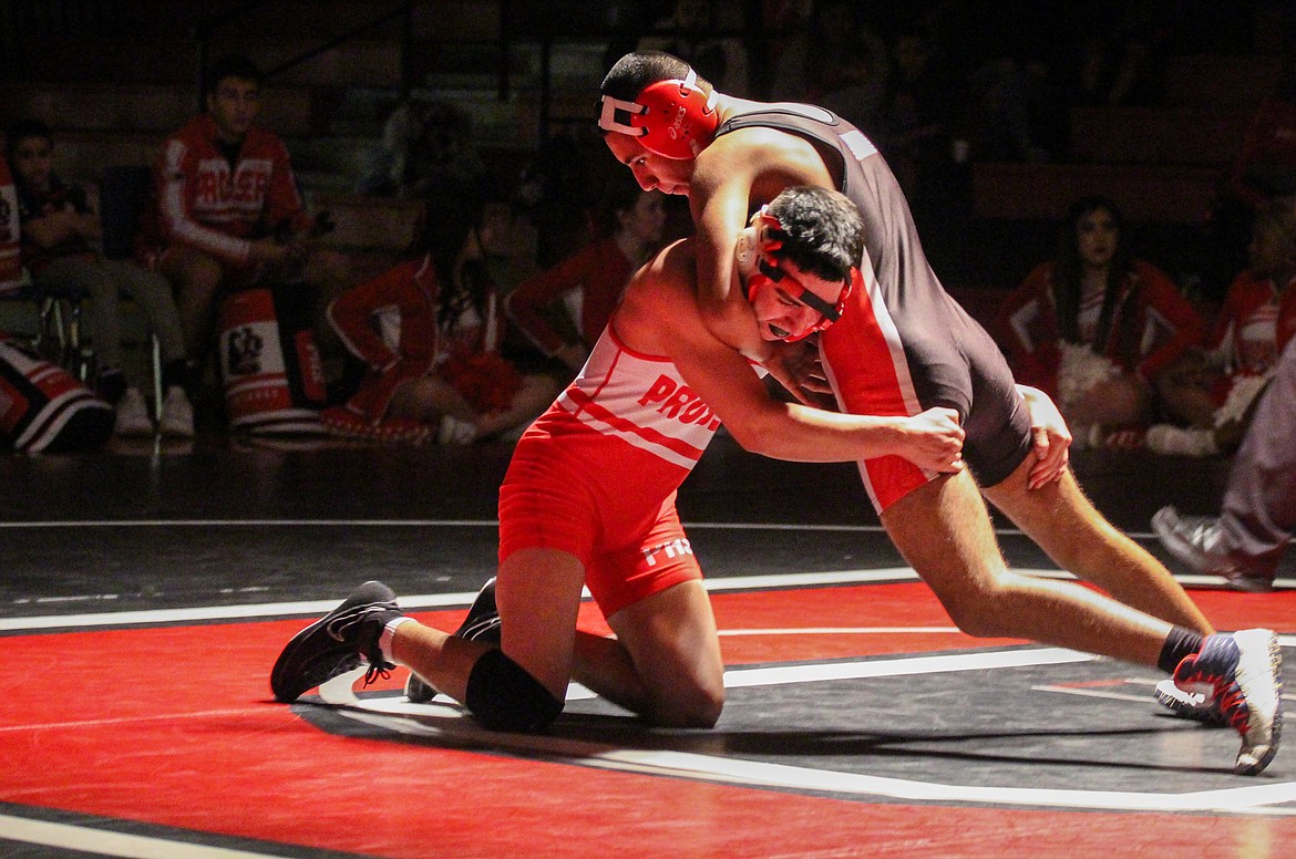 Casey McCarthy/Columbia Basin Herald Andy Deleon Jr. works to gain some late points in the third round as the Othello wrestler took the 7-2 decision in his bout at 126.