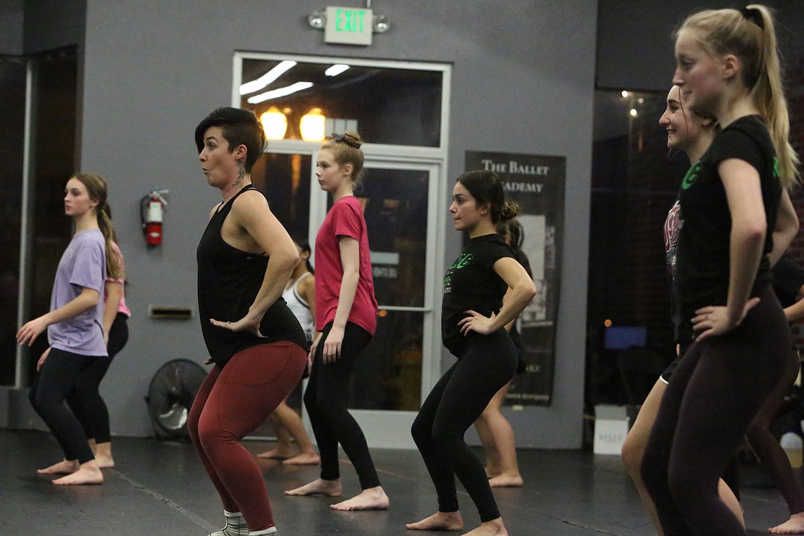 Rian Miles, black and maroon outfit, leads the Ballet Academy’s highest level jazz dance class, working her students through a set of high-energy exercises while making funny faces and bobbing her head to the beat of Laura Branigan’s “Gloria.”