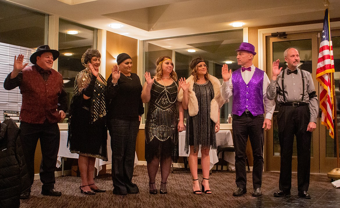 Moses Lake-Othello Association of Realtors’ new officers and directors raise their hand as they’re sworn in. From the left are: Doug Robins, Cindie Conklin, Tara Zerbo, Danielle Svilar, Tami Canfield, Barry Lawson and Kevin Burgess.