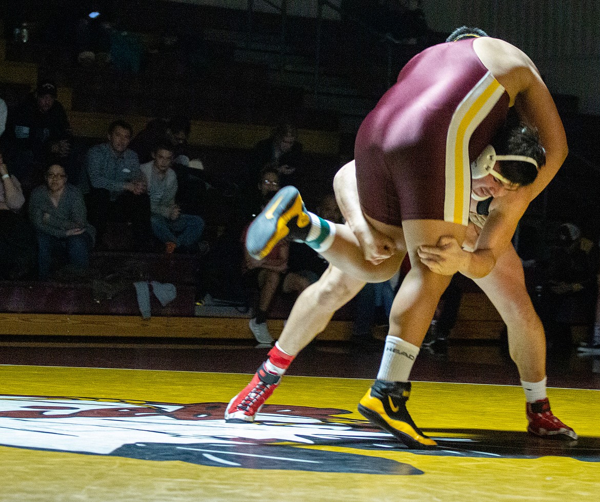 Isaiah Perez picks up his opponent from Moses Lake moments before slamming him to the mat in a road dual earlier this season.