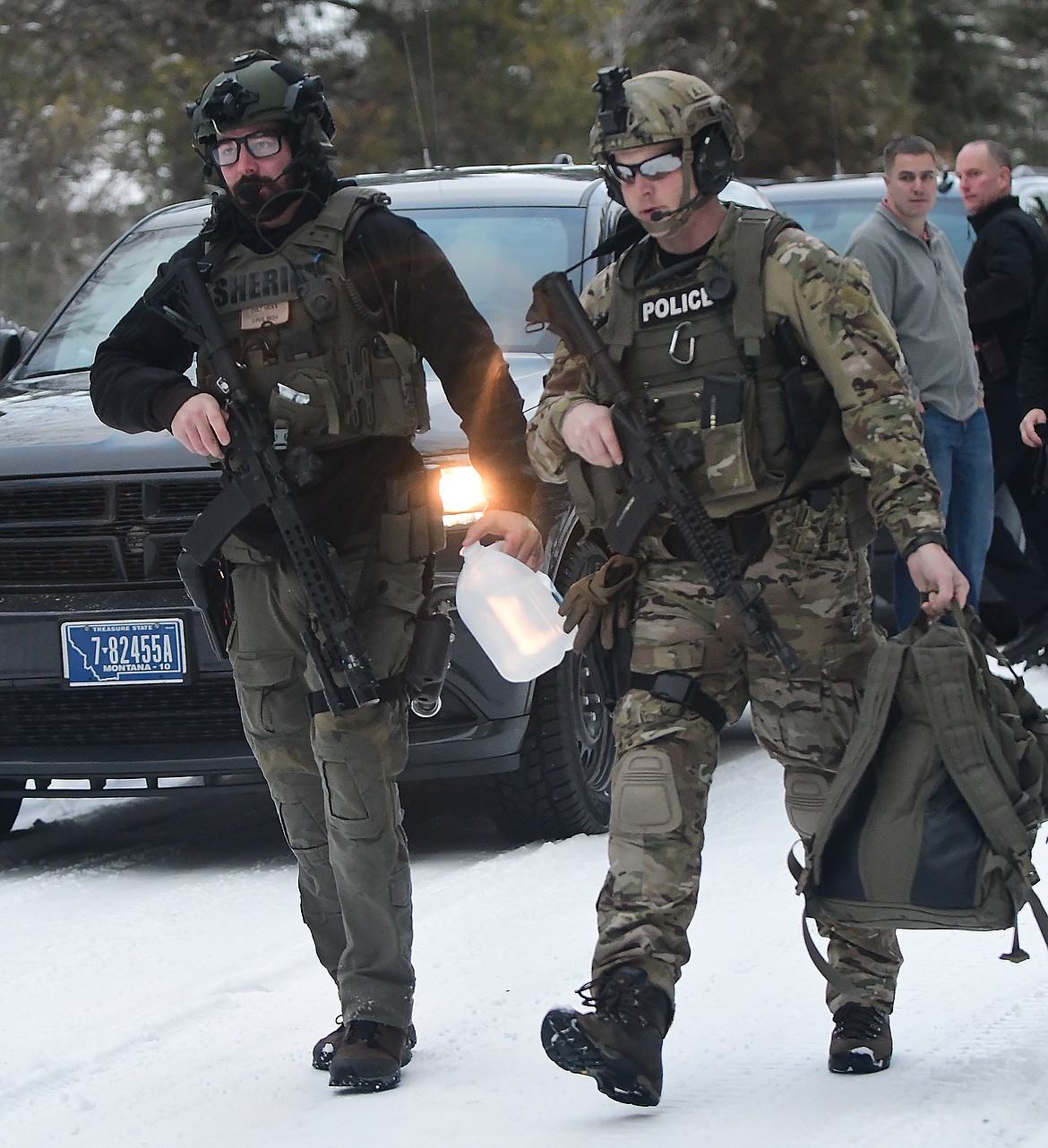 Flathead County SWAT team members respond to a fugitive holed up in a house in Hungry Horse Tuesday evening. (Teresa Byrd photo)