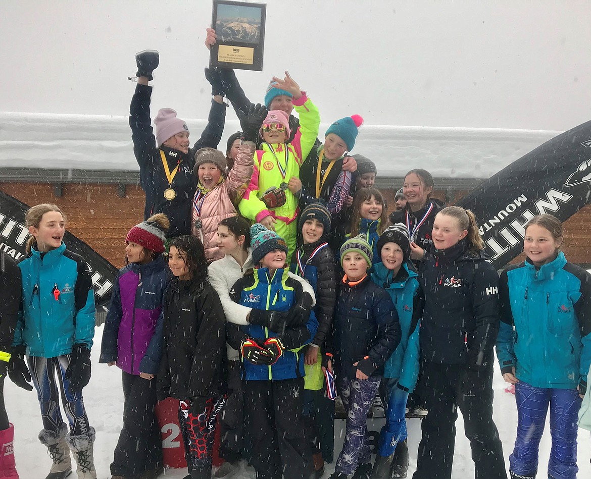 The Flathead Valley Ski Education Foundation racers celebrate their team title Sunday during the Sportsman Ski Haus-Northern Division U.S. Ski Association Youth Ski League race series at Whitefish Mountain Resort. (Photo courtesy Sherri Hale)