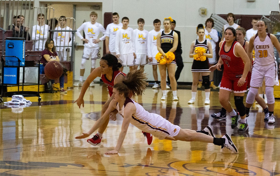 Casey McCarthy/Columbia Basin Herald Sophomore Olivia Waites dives for the loose ball in Moses Lake’s 72-32 win over Eisenhower at home on Saturday night.