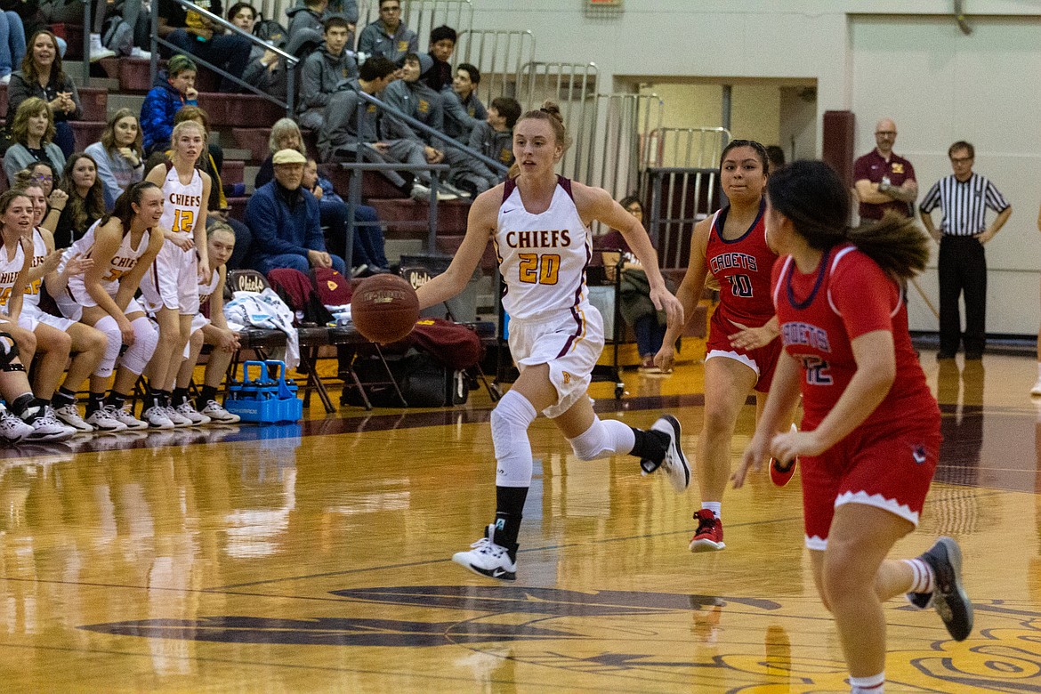 Casey McCarthy/Columbia Basin Herald Camille Carpenter drives up the floor after forcing the turnover against Eisenhower on Saturday night.