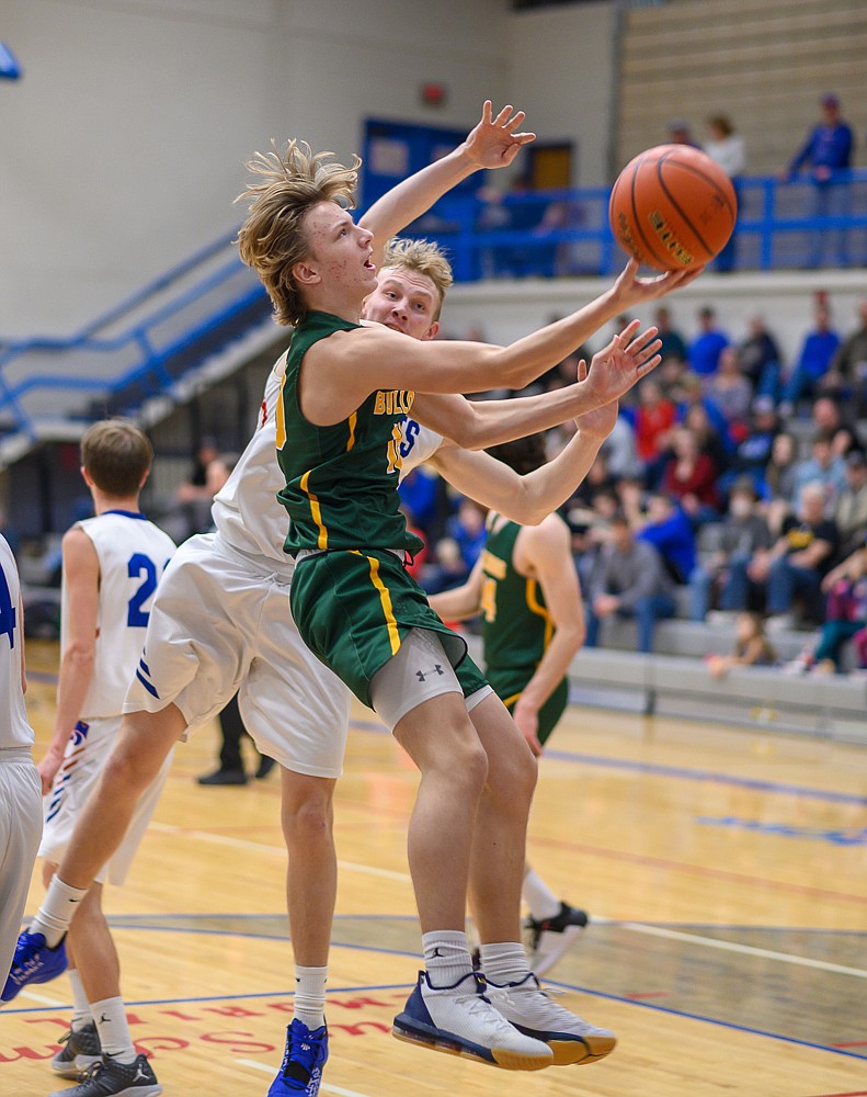 Jaxsen Schlauch goes for the scoop layup during Friday's road loss to Columbia Falls. (Chris Peterson/Hungry Horse News)