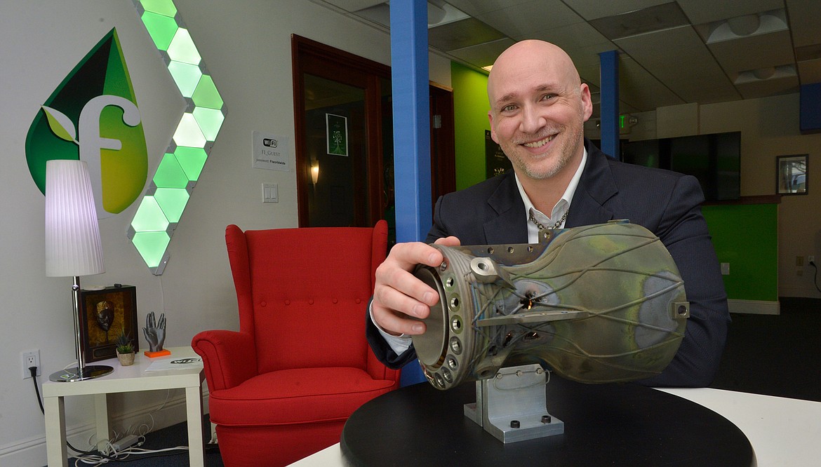 Aaron Davis, CEO and founder of Whitefish-based Mountain Aerospace Research Solutions shows off the first Fenris rocket engine, which he says will make getting into space cheaper and safer. The engine was created on a 3D metal printer, contains no moving parts and can be reusable. It was test fired on July 26, 2019, at a test facility in California’s Mojave Desert. (Photo courtesy Doug Jorgensen, for Mountain Aerospace Research Solutions)