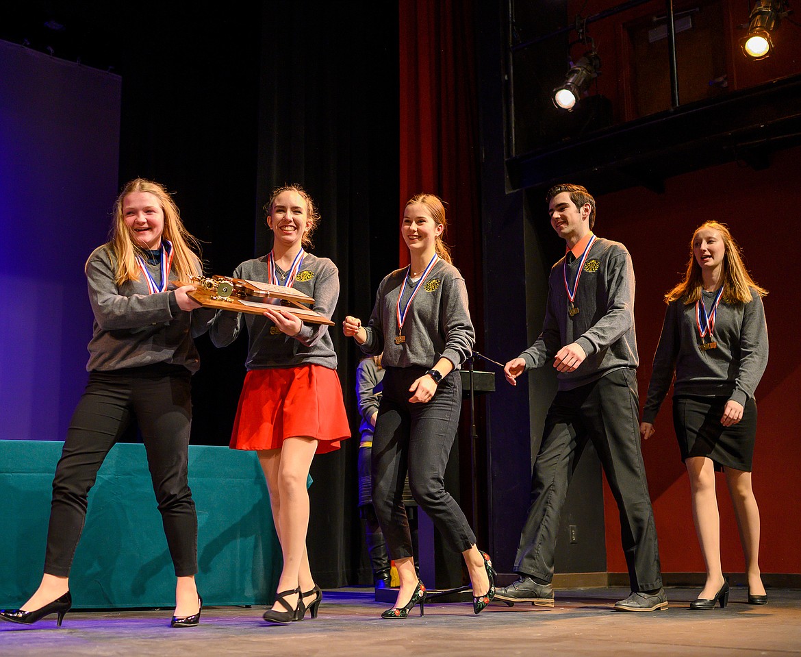 Whitefish state champions, from left, Danika Tintzman (impromptu), Bethany Barnes (informative), Grace Benkelman (memorized public address), Logan Mercer (humorous interpretation), and Abigail Bowden (extemporaneous), accept the team’s plaque for their second place finish at the Class A state speech and debate meet Saturday at the Whitefish Performing Arts Center. (Chris Peterson/Hungry Horse News)