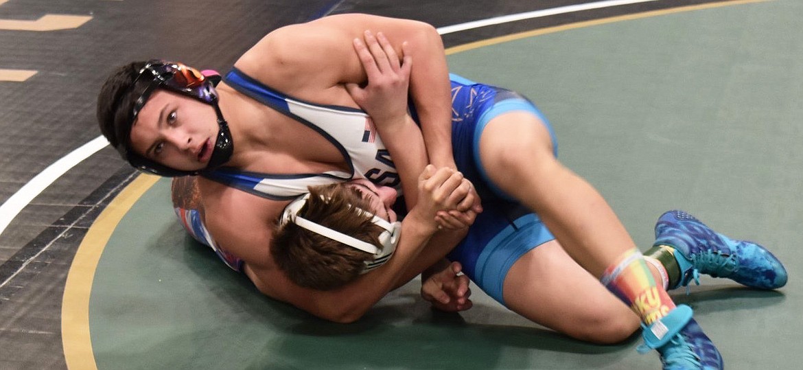 Jace DeShazer prepares to pin his opponent during the Jan. 25 Winter Warrior Classic tournament in Spokane, Wash. (Courtesy photo)