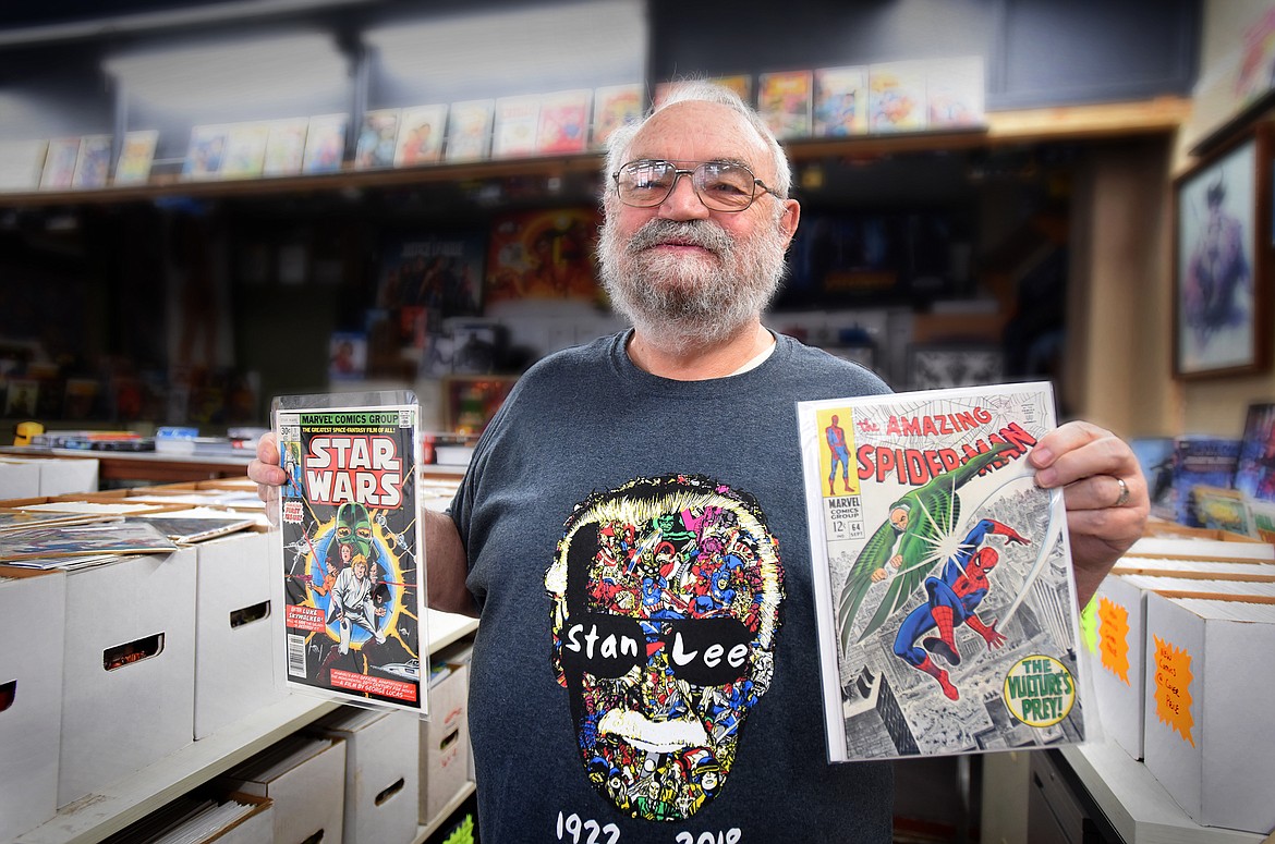 Comics Arcade owner Randy Sheppard shows off a few comics from his personal collection.