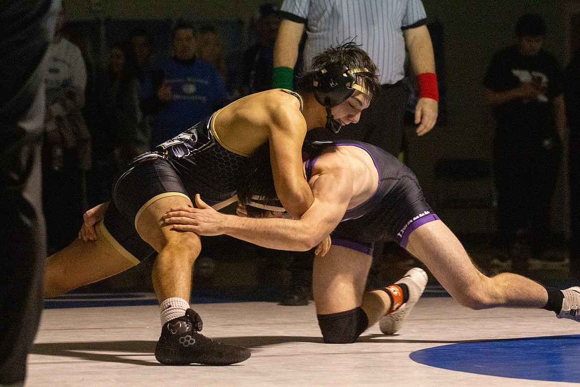 Casey McCarthy/Columbia Basin Herald Lorenzo Myrick of Royal keeps Connell’s Jaxsen Tuttle in place in the championship round of the 160 weight class on Saturday afternoon at Warden High School.