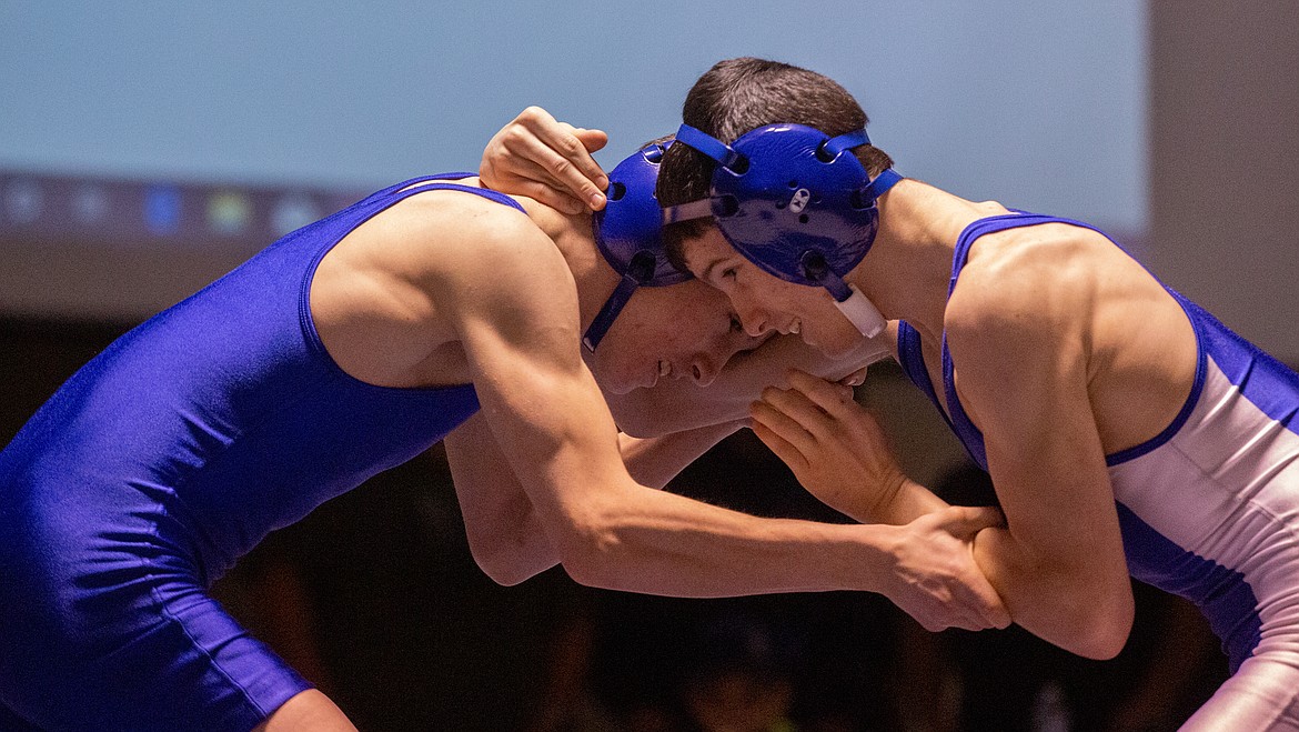 Twin brothers, Cael (left) and Cason Cox from Warden, face off in the finals at 113 in the 1A SCAC East district tournament on Saturday.