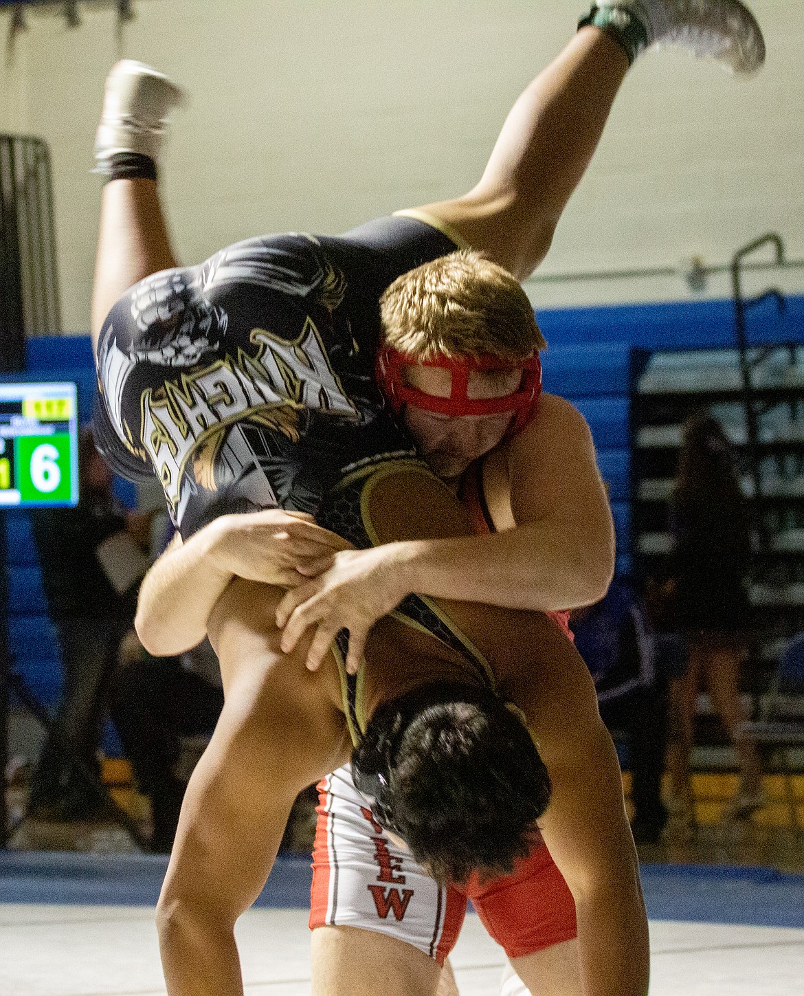 Casey McCarthy/Columbia Basin Herald River View’s Bryson Ashley throws Royal’s Kevin Dominguez to the mat in the championship round of the 220 weight class on Saturday. Dominguez would take first place, picking up the third-round pin.