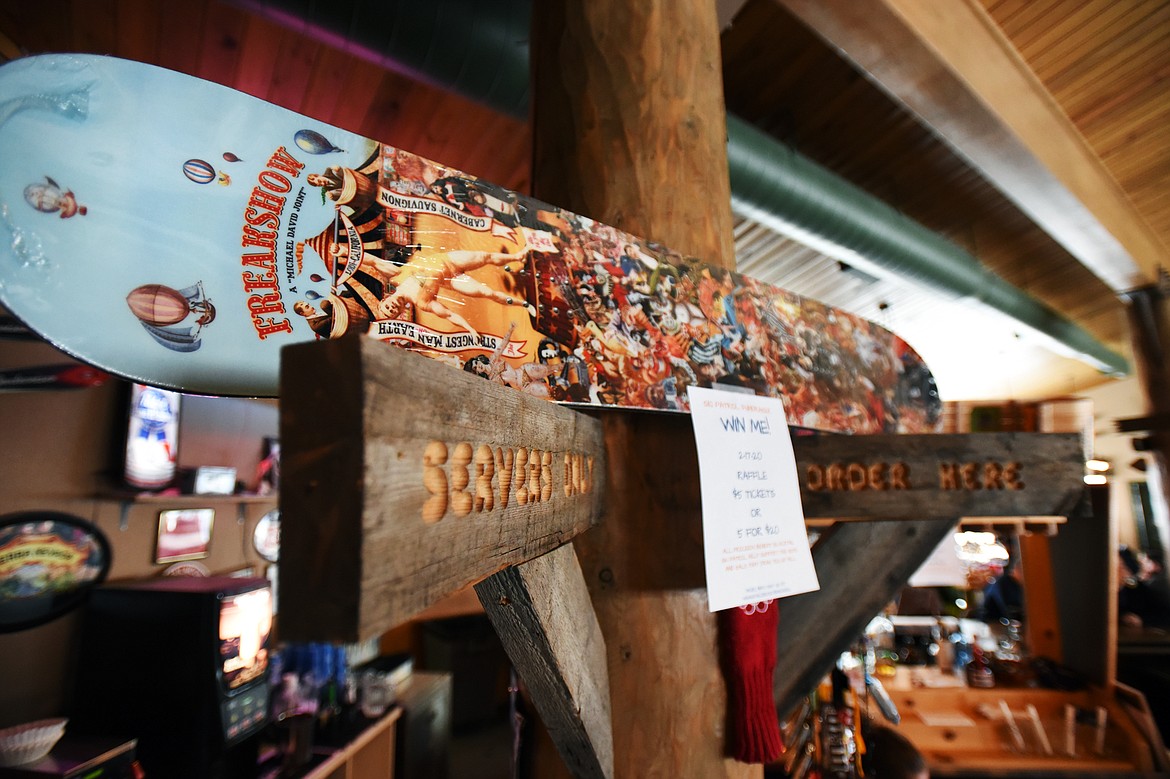 A snowboard to be raffled off as part of the Blacktail Mountain Ski Patrol’s annual Poker Run fundraiser is shown at Muley’s Pub and Restaurant inside the lodge on Thursday, Feb. 6. (Casey Kreider/Daily Inter Lake)