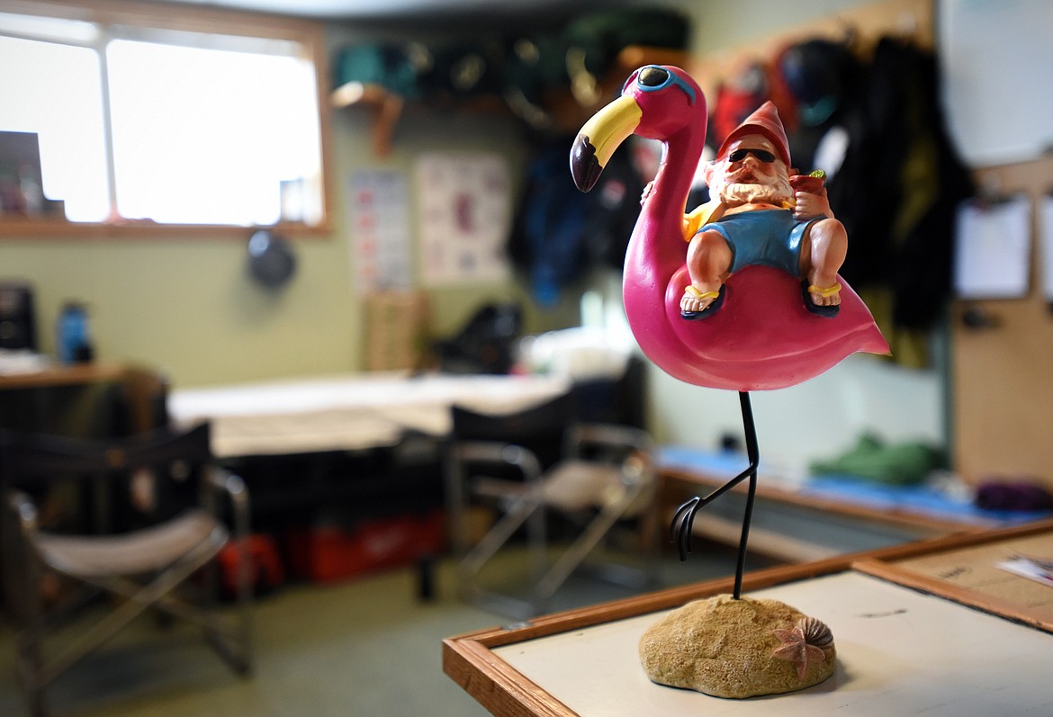 A gnome and pelican figurine on a counter inside the Blacktail Ski Patrol office. A gnome hunt is a part of the ski patrols’ annual fundraiser.