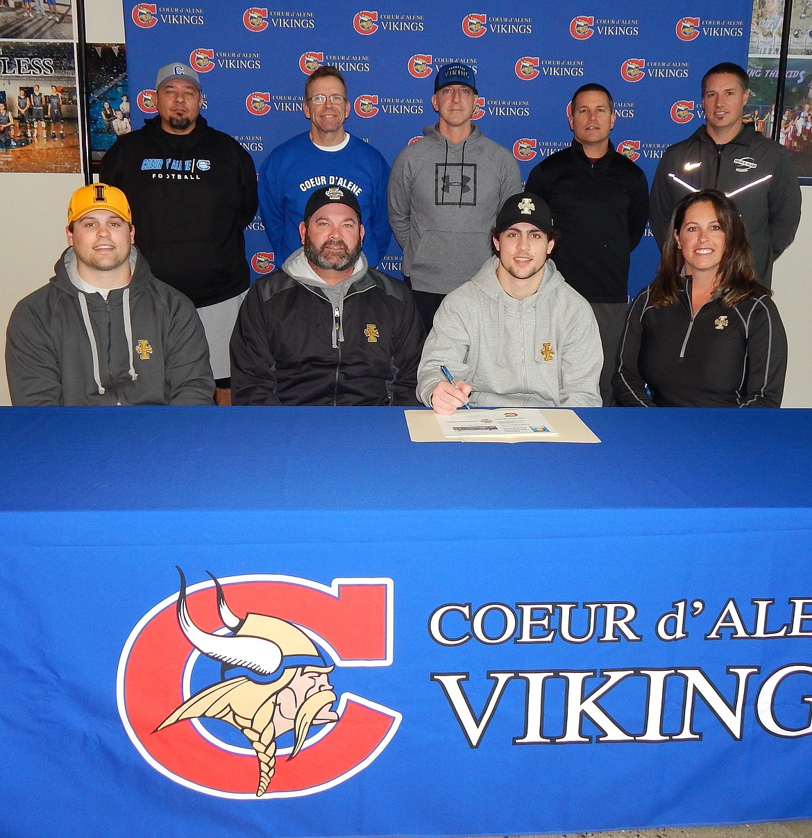 Coeur d’Alene High senior Colbey Nosworthy recently signed a letter of intent to play football at the University of Idaho. Seated from left are Cameren Nosworthy (brother), Chris Nosworthy (dad), Col