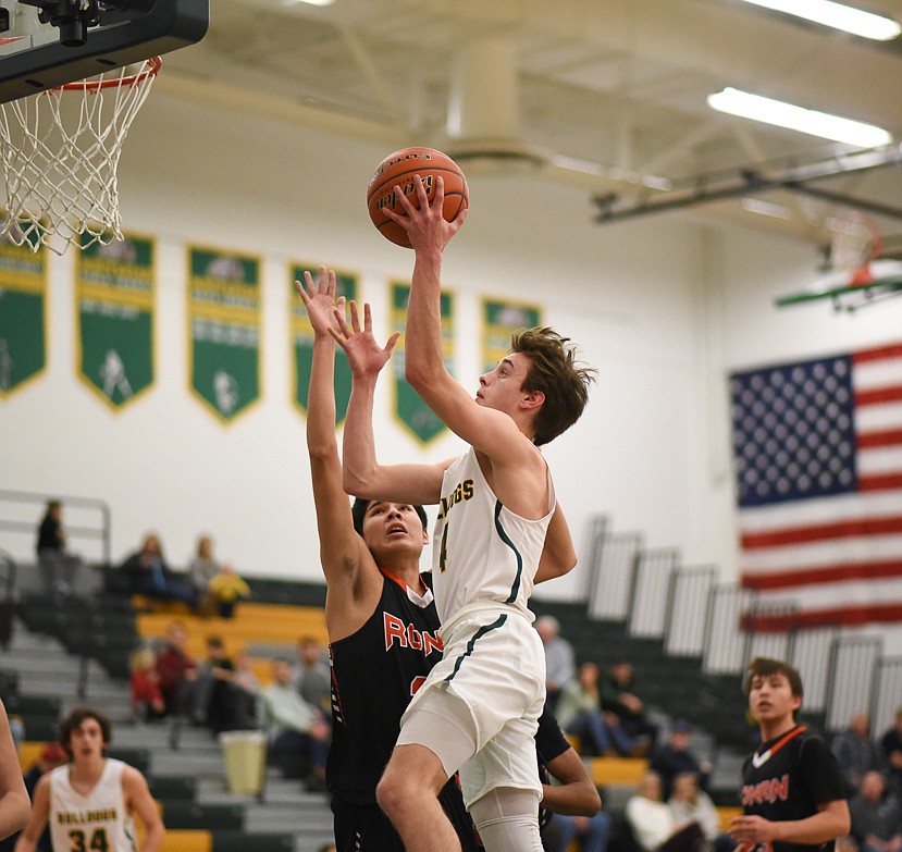 Bodie Smith rises for the layup during the Bulldogs' home loss last Tuesday. (Daniel McKay/Whitefish Pilot)