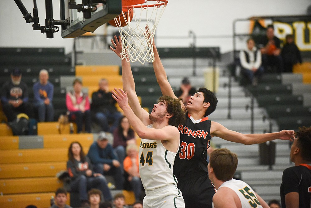 Sam Menicke puts up a close shot during the Bulldogs' home loss last Tuesday. (Daniel McKay/Whitefish Pilot)