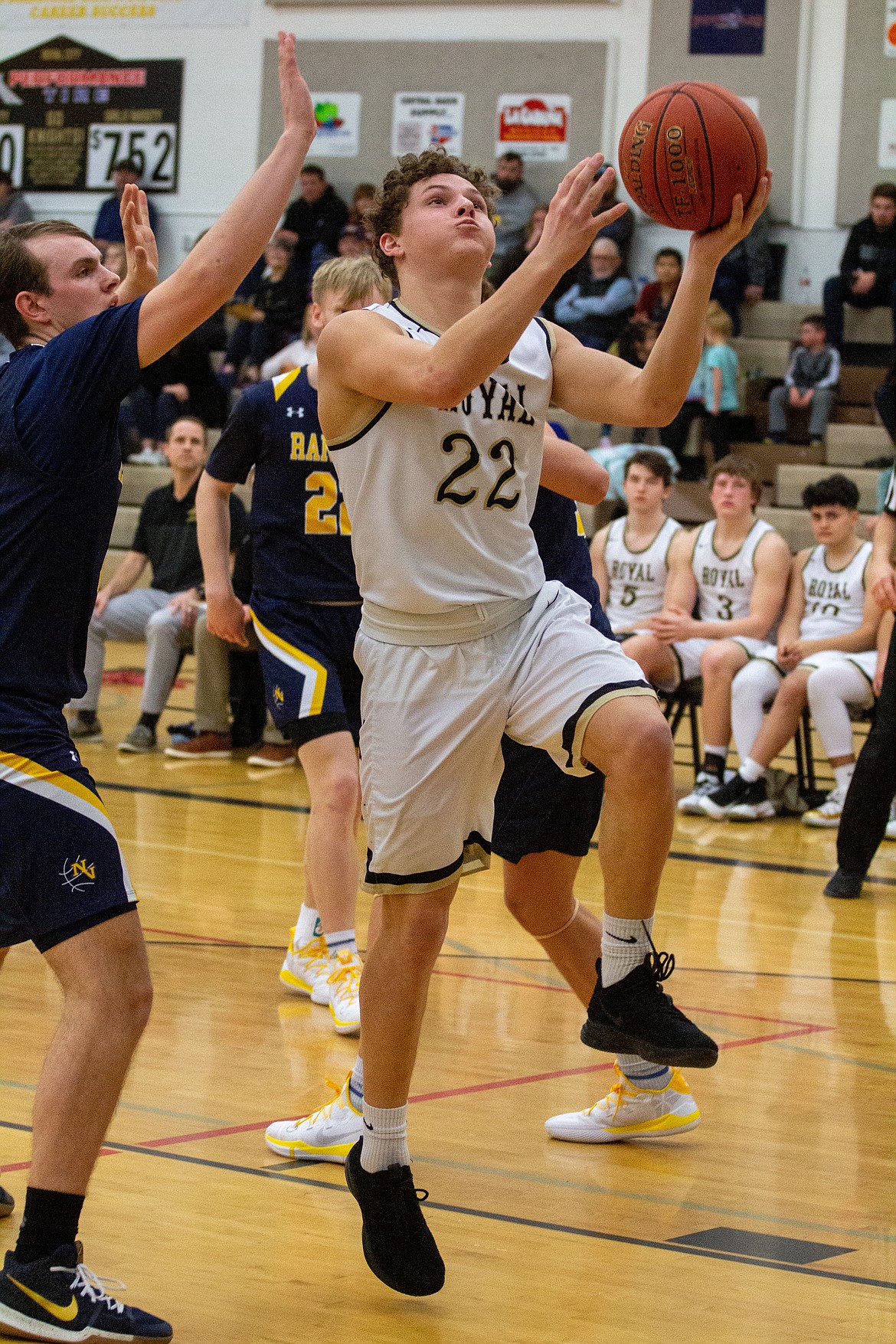 Casey McCarthy/Columbia Basin Herald Royal guard Tyler Allred glides in for the layup against Naches Valley on Tuesday night at Royal High School.