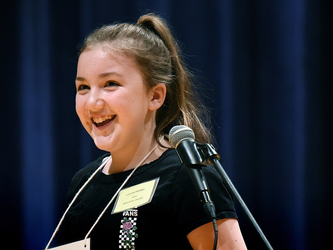 Mary Grace Carey, from Cayuse Prairie School, smiles after correctly spelling “cemetery” to win the 2020 Flathead County Spelling Bee at Glacier High School on Thursday. (Casey Kreider/Daily Inter Lake)