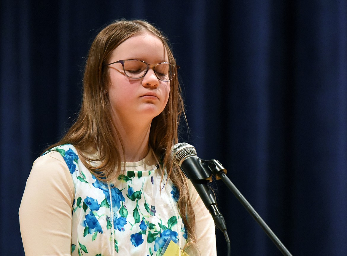 Abigail Rye, from Flathead Home Educators Association, closes her eyes before spelling the word “garment” at the 2020 Flathead County Spelling Bee.