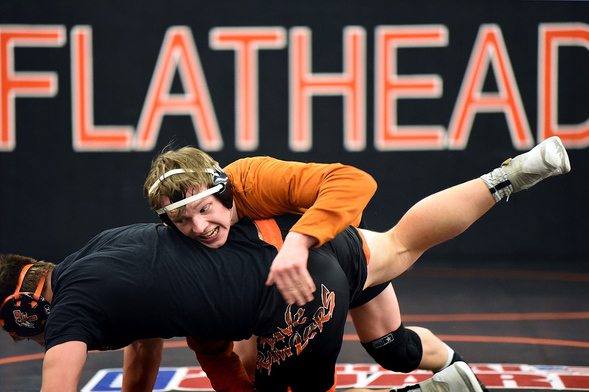 Flathead’s Garett Rieke, top, works with teammate Paxton Boyce during practice at Flathead High School on Wednesday, Feb. 12. (Casey Kreider/Daily Inter Lake)