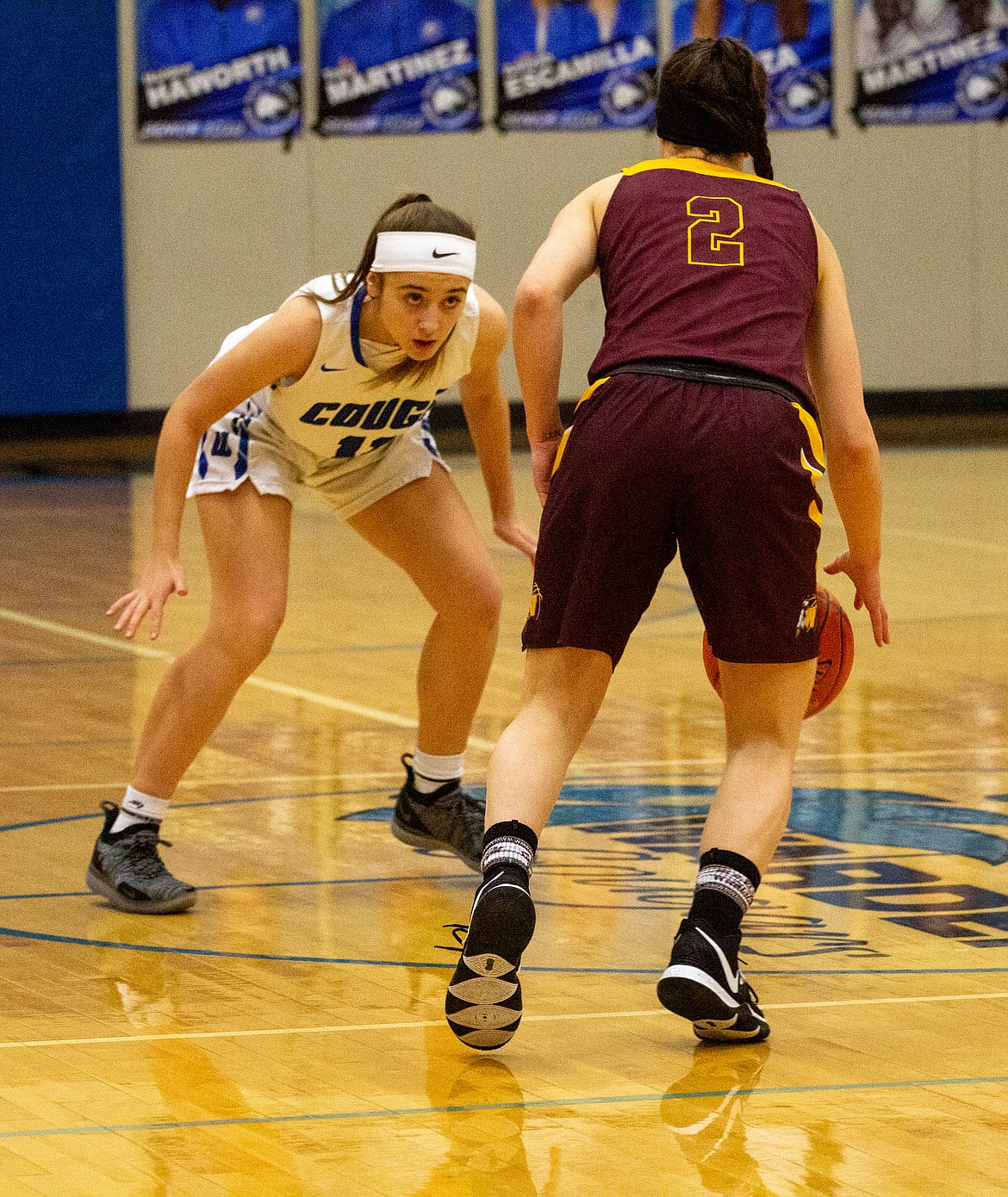 Casey McCarthy/Columbia Basin Herald Freshman Quinn Erdmann locks down her opponent near midcourt in the first quarter of the Cougars’ matchup against the Warriors of Cle Elum on Thursday night.