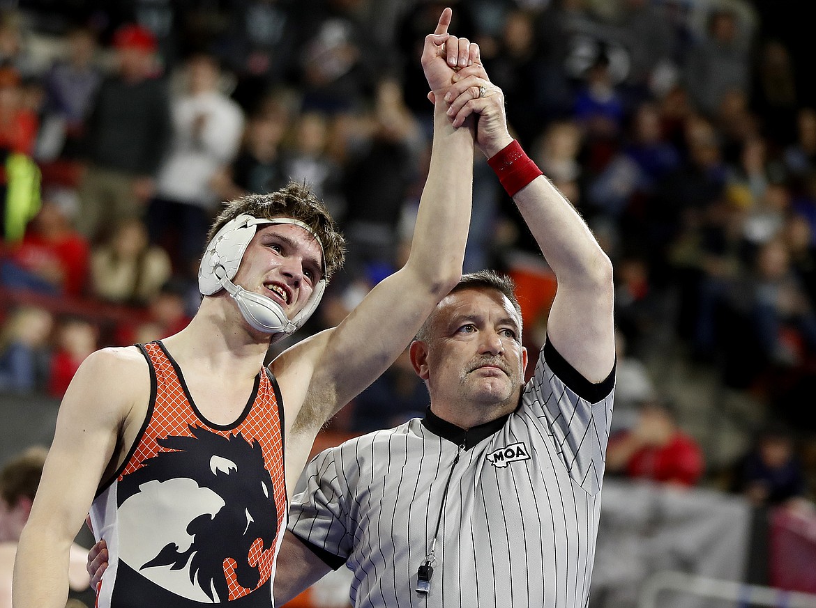 Hank Dunn of Eureka celebrates his win over Riley Forcella of Whitehall wrestle in the Class B-C 152-pound championship match at the state wrestling tournament at First Interstate Arena on Saturday. (Casey Page/Billings Gazette)