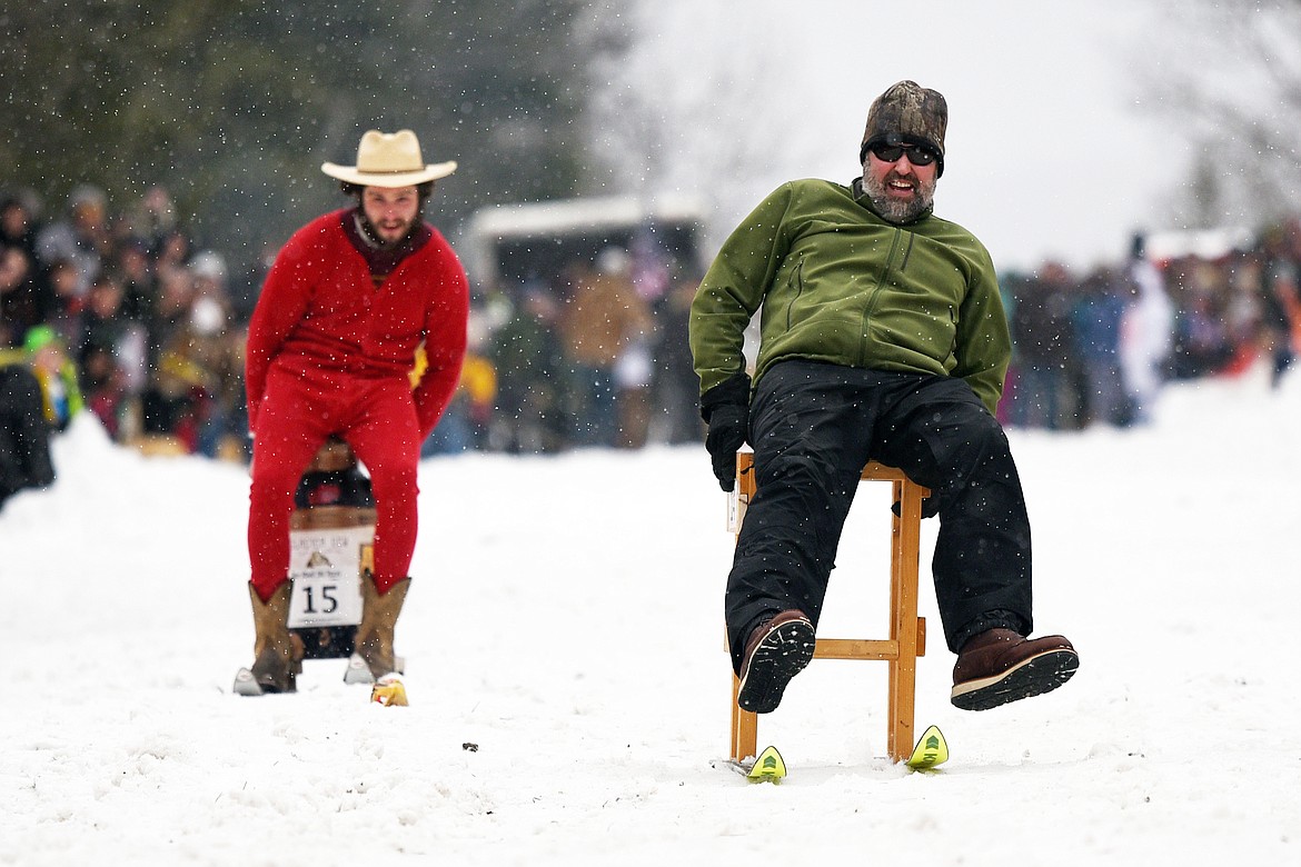 Participants race down Sugar Hill during the Barstool Ski Races at Cabin Fever Days in Martin City on Saturday, Feb. 15. (Casey Kreider/Daily Inter Lake)