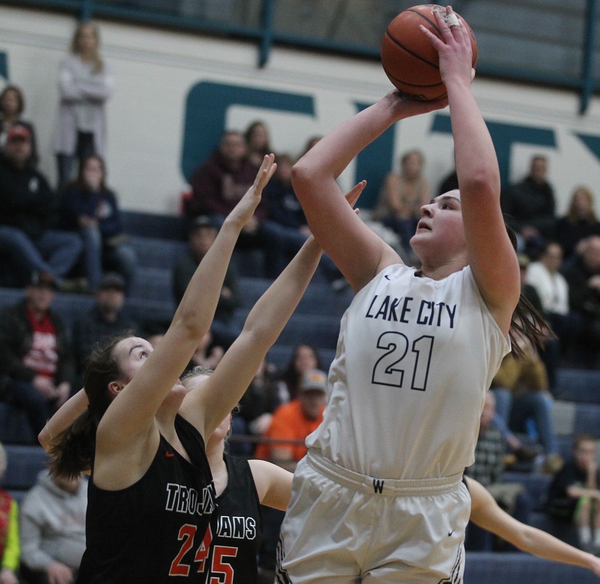 JASON ELLIOTT/Press 
 Lake City junior Brooklyn Rewers shoots over Post Falls freshman Capri Sims during the third quarter of the 5A Region 1 girls basketball tournament second-place game at Lake Cit