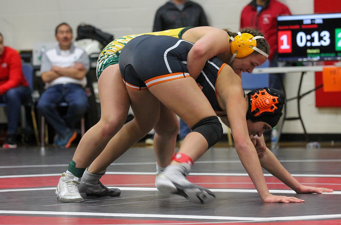 Casey McCarthy/Columbia Basin Herald Quincy’s Shannon Workinger works to force her opponent from Kennewick to the mat in the finals bout at 155 on Saturday.