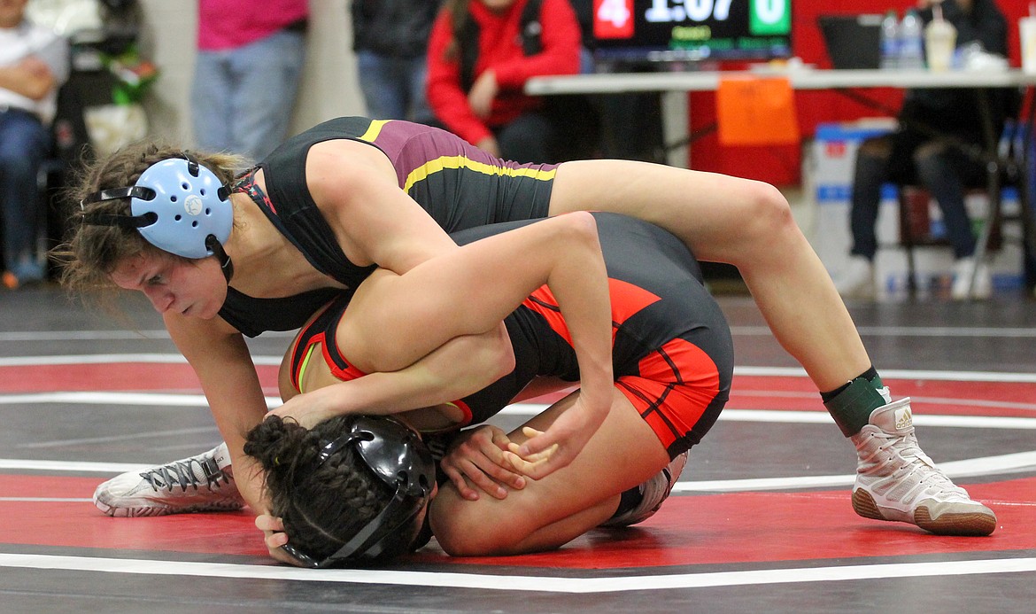 Casey McCarthy/Columbia Basin Herald Moses Lake’s Bianca Johnson looks to make up points, or secure a pin, in the third round of her finals bout against Othello’s Iyazely Barraza.