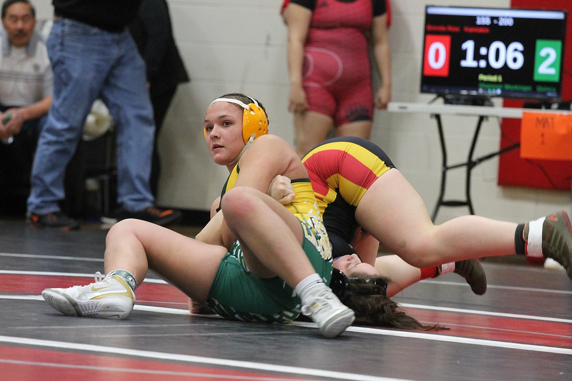 Casey McCarthy/Columbia Basin Herald Quincy’s Shannon Workinger picked up the first-round pin against her opponent, Brenda Rios, to advance to the finals on Saturday afternoon at Othello High School.