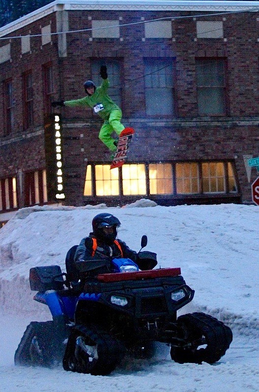 One of the event’s younger competitors catches some air after going off the big jump on the track. The tracked-ATV that pulled riders cruised down the track at roughly 30 mph.