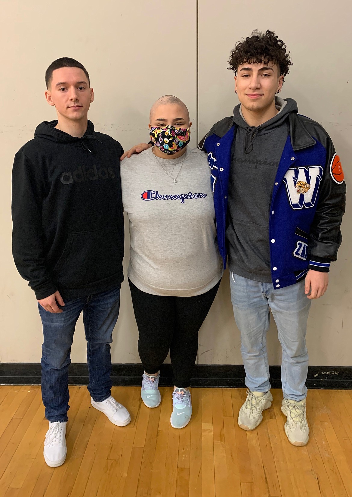Tyson Wall, Avree Pruneda and Ayzaiah Pruneda at Warden High School. Avree Pruneda must wear a mask now to prevent her from getting sick as she begins chemotherapy.