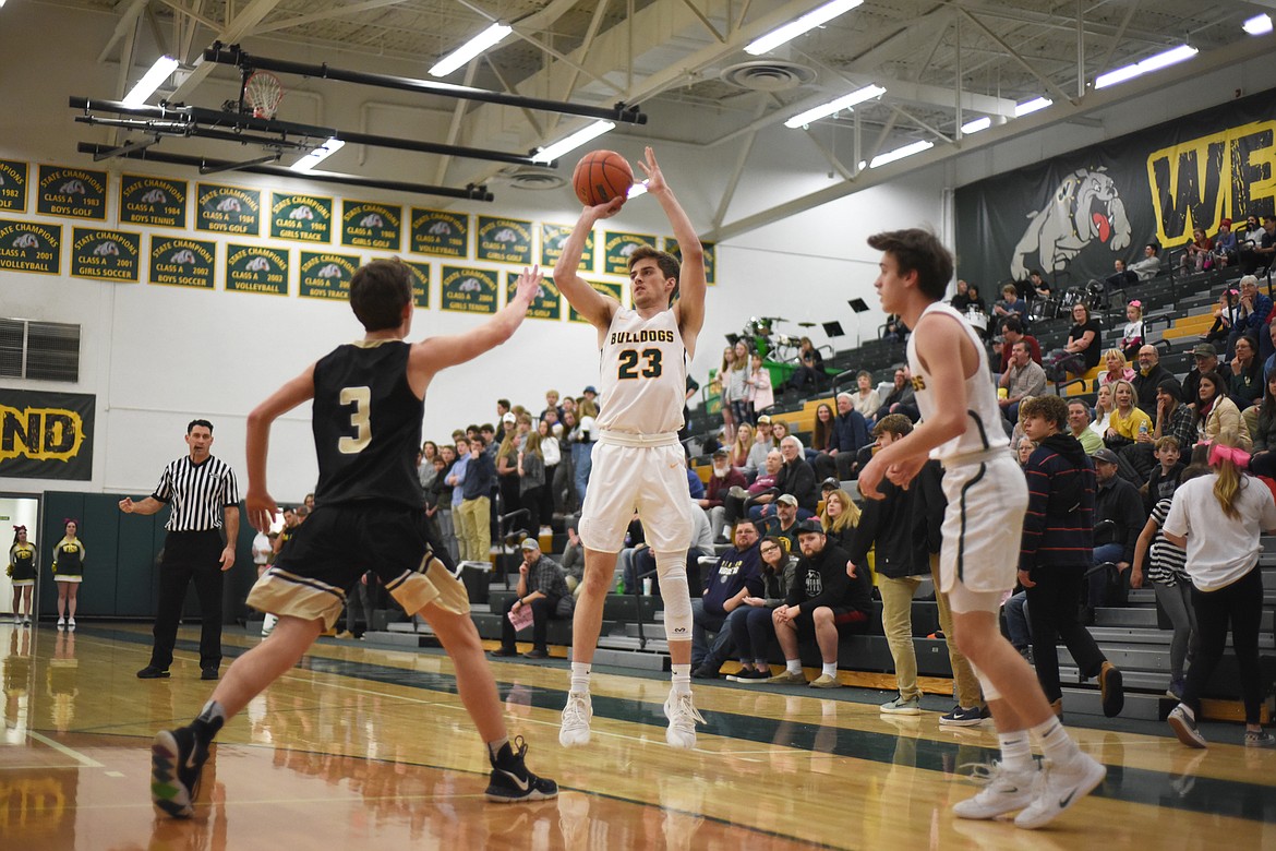 Justin Conklin fires a three during Friday’s home battle against Stevensville. (Daniel McKay/Whitefish Pilot)