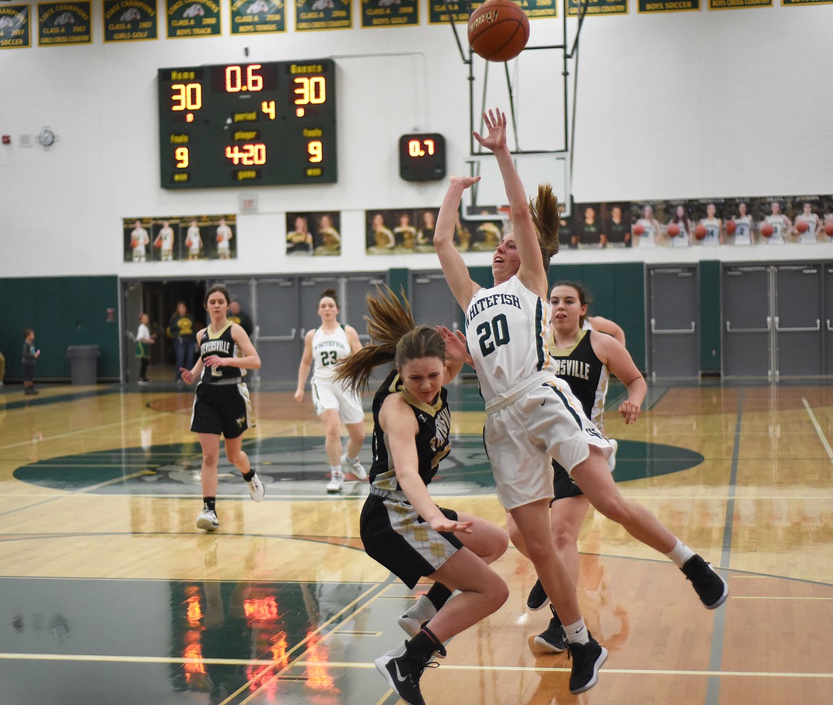 Mikenna Ells draws the foul before sinking the game-winning free throw in Friday’s home win over Stevensville. (Daniel McKay/Whitefish Pilot)