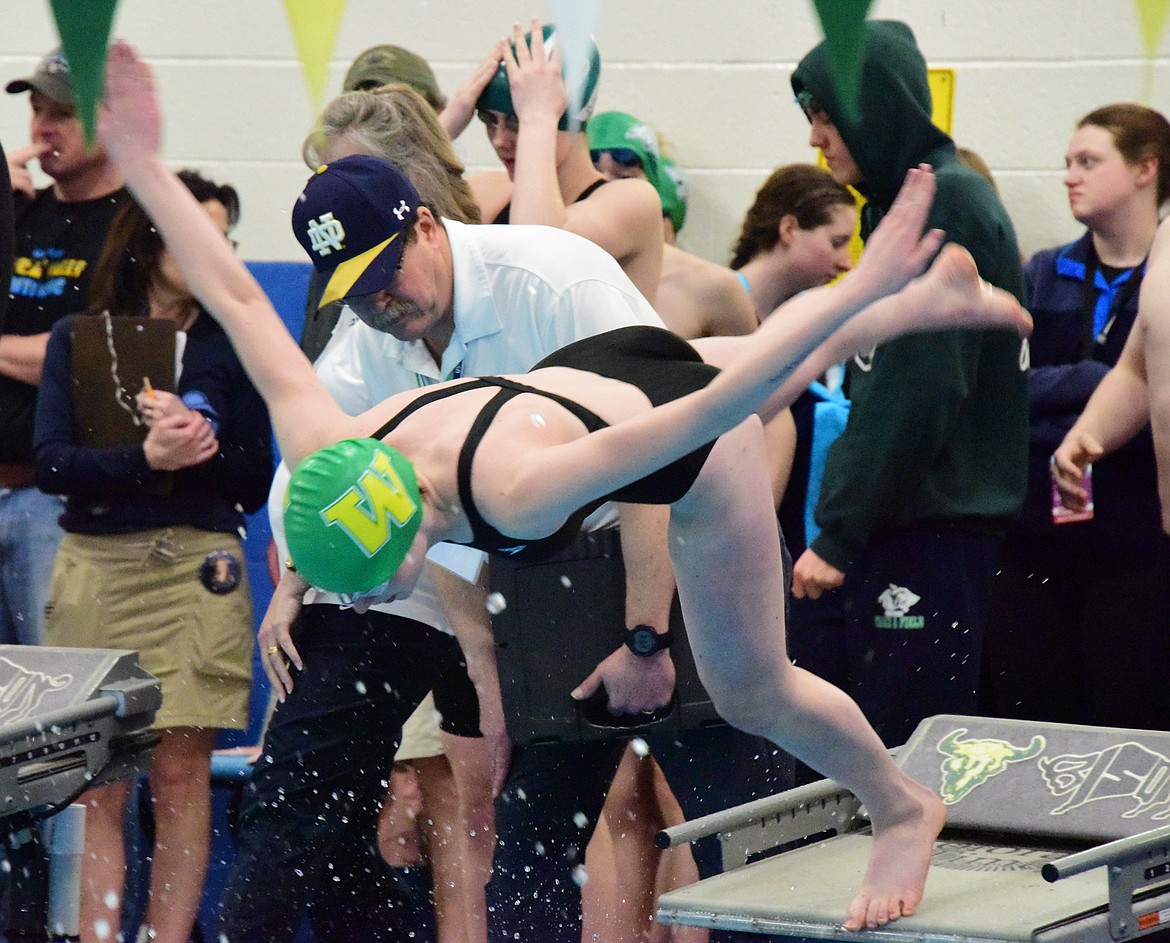 Whitefish’s Kay Weaver jumps off at the start of the 50 free at the All-Class State Tournament in Great Falls. (Photo courtesy Corey Botner)