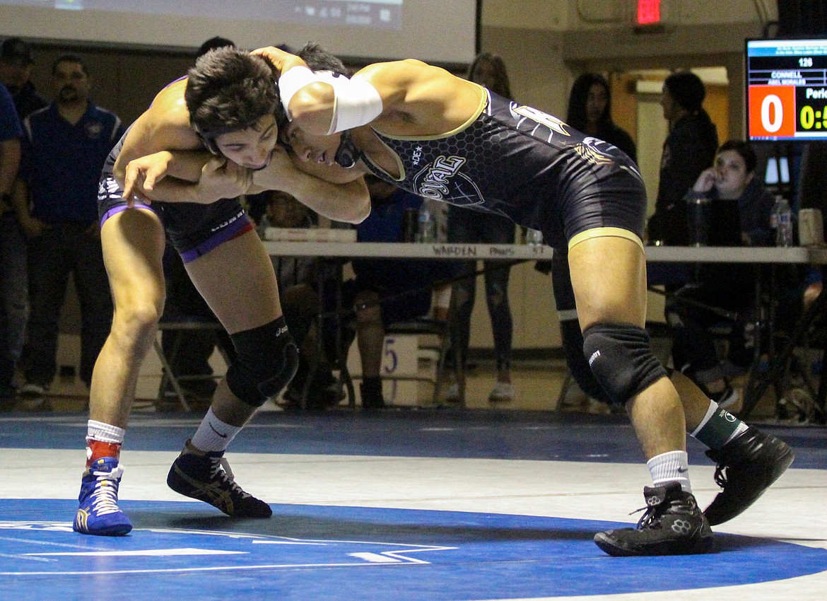 Casey McCarthy/Columbia Basin Herald Royal’s Yahir Morales faced off against Connell’s Abel Morales for the second-straight weekend at regionals on his way to cementing his place at the Mat Classic.