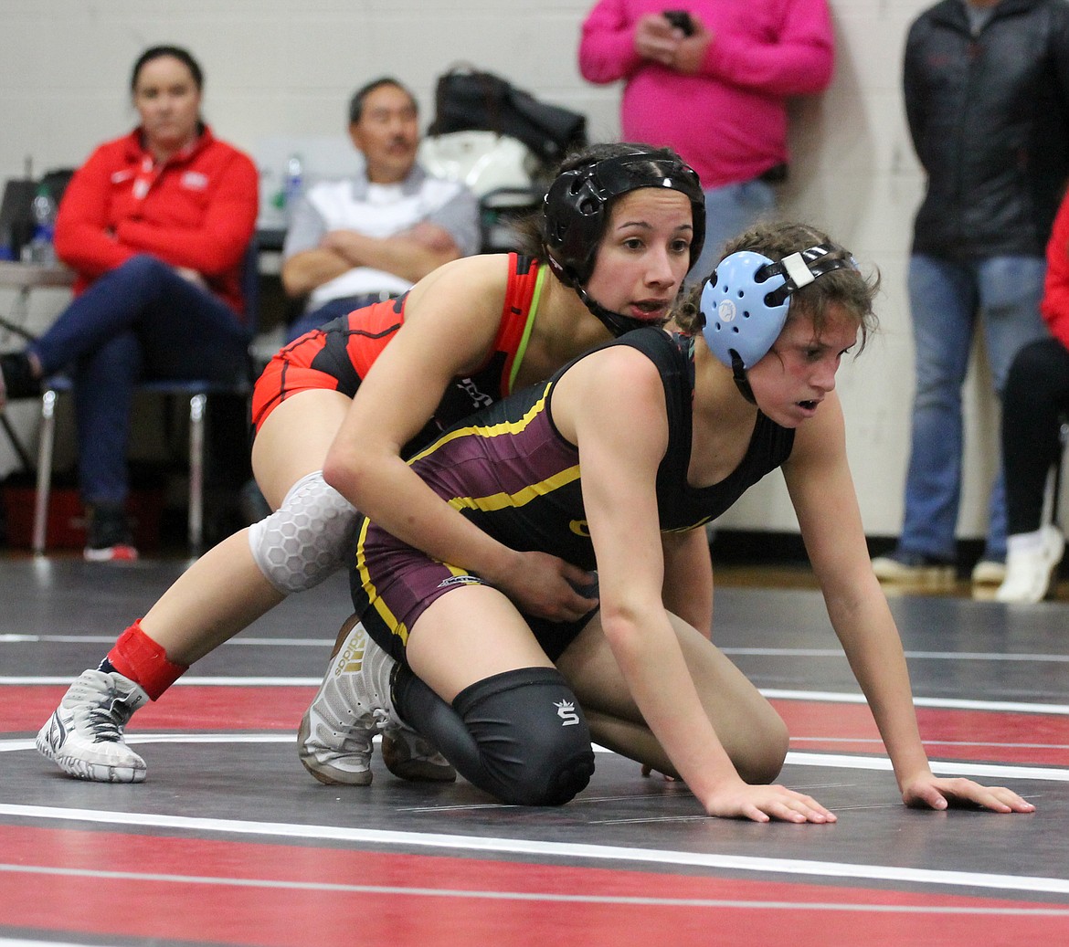 Moses Lake’s Bianca Johnson and Othello’s Iyazely Barraza get set for the match to restart after a stoppage in the finals at 115 last Saturday at Othello High School.