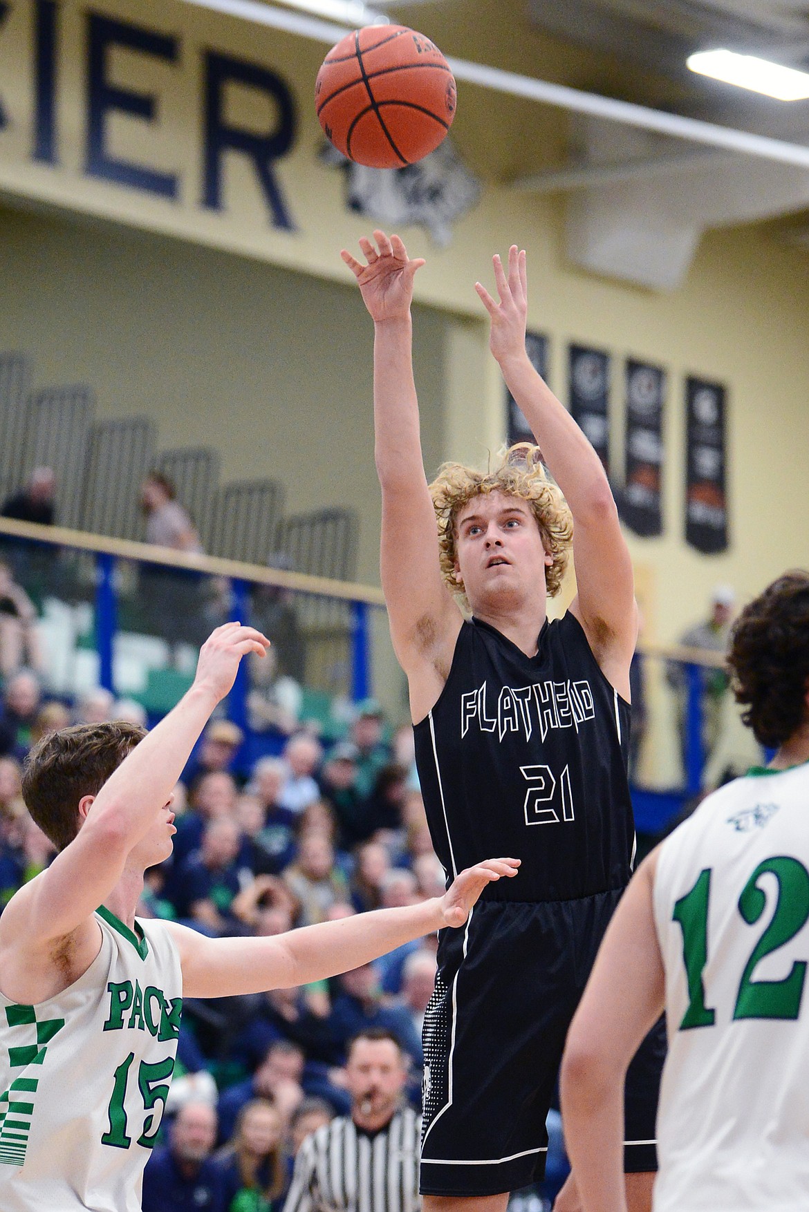 Flathead's Ethan Vandenbosch (21) looks to shoot against Glacier during a crosstown matchup at Glacier High School on Friday. (Casey Kreider/Daily Inter Lake)